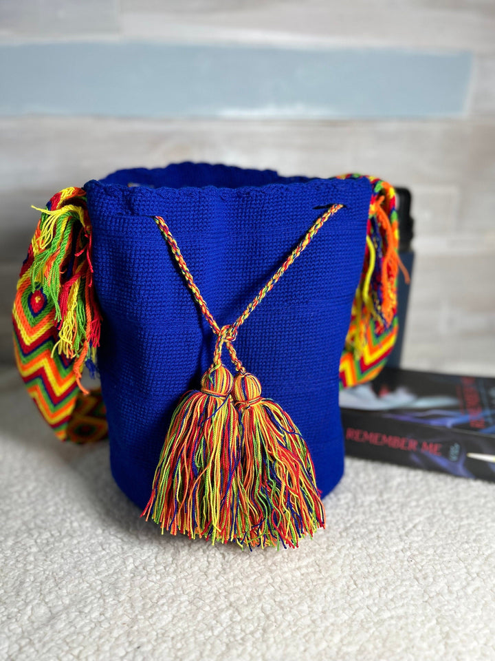 Practical crochet bag, multi color pom pom front view